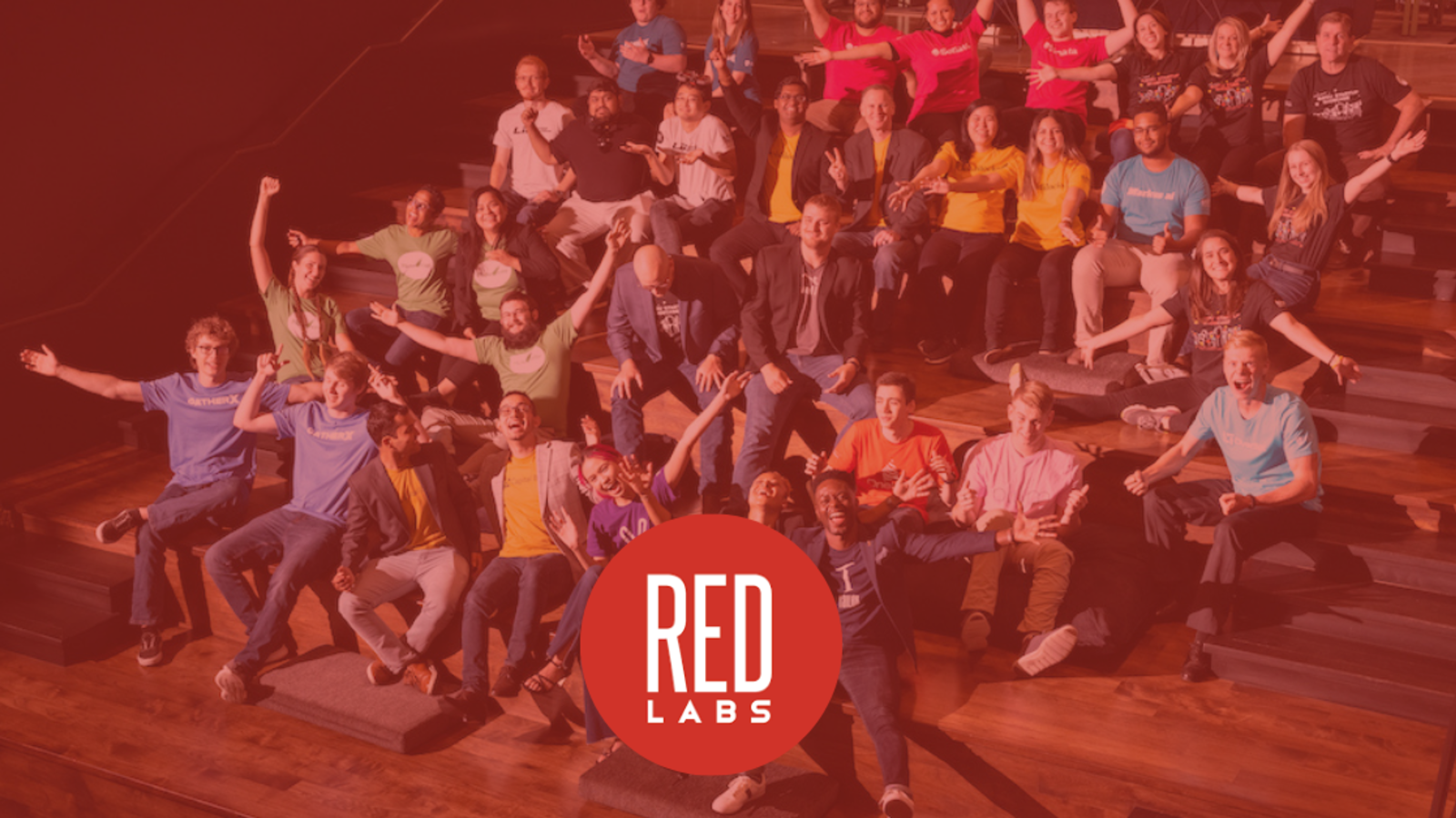 In Partnership with RedLabs, Group of students with RedLabs logo