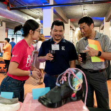 Three people talking at Bayou Startup Showcase